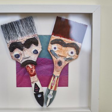 Paintbrushes with faces in a frames