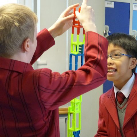 students building a plastic structure