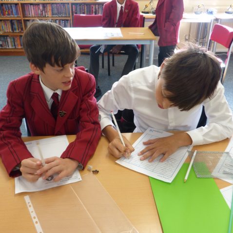 students writing onto sheets