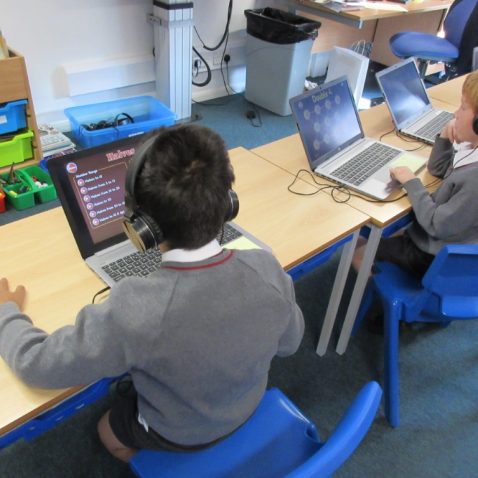 Children working on their own laptops