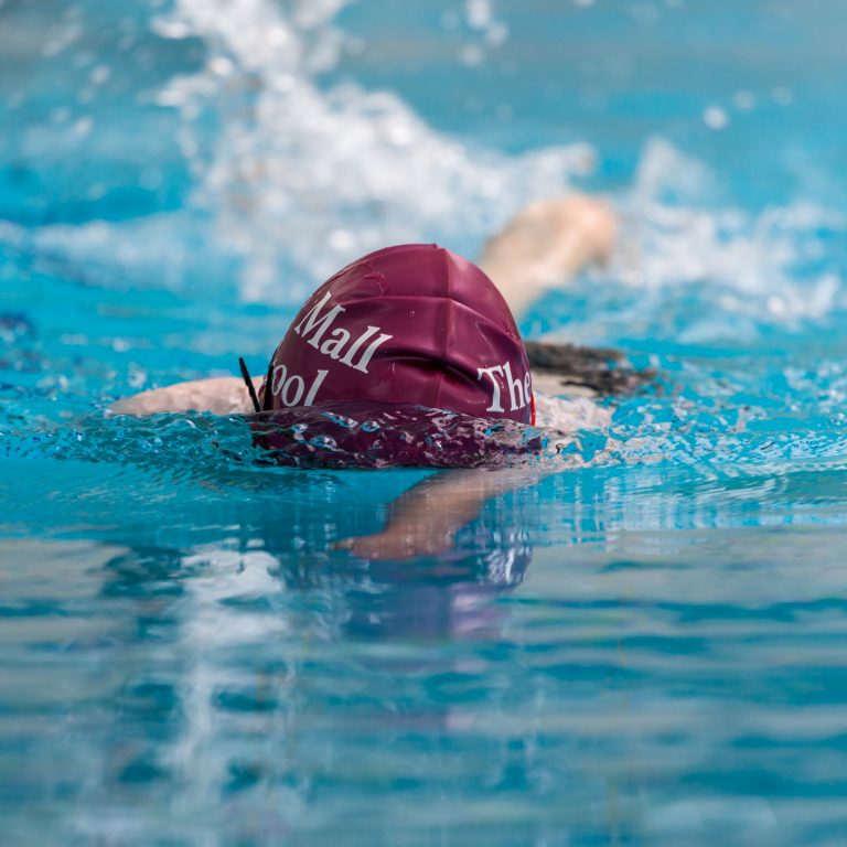 child swimming in the pool