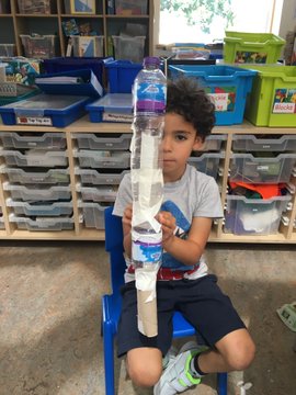tower made from water bottles and tissue rolls