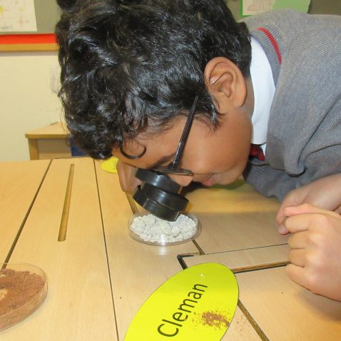 boy with a magnifying glass