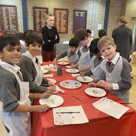 children painting and smiling