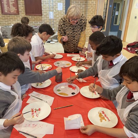 children painting with their pears