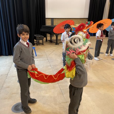 students wearing dragon outfit