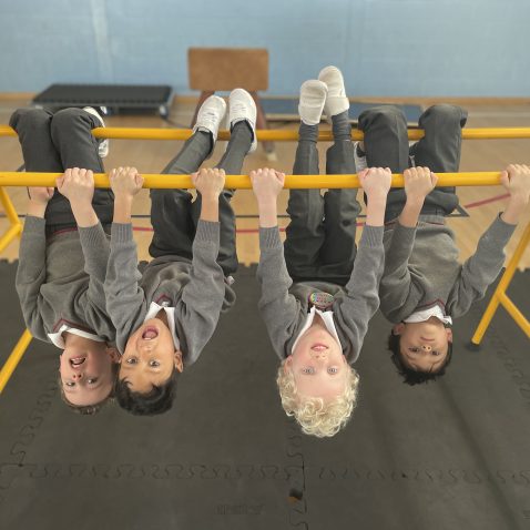 students on a balancing bar