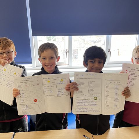 children with their marked excercise books