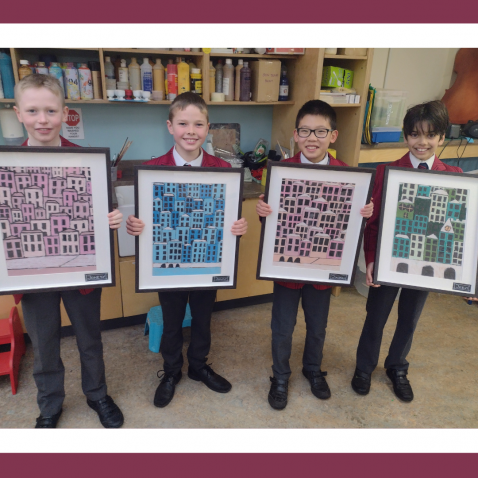 students holding frames