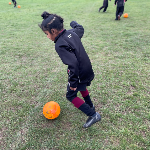 students playing football