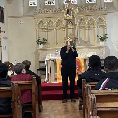 man holding a cross