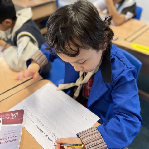 student writing out onto a piece of paper