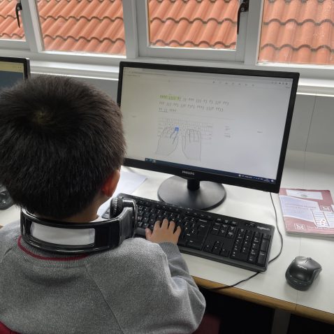 students learning to touch type