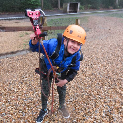 student on a zip wire