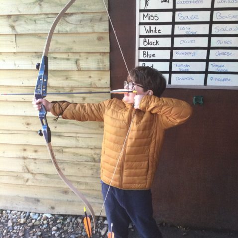 student with an archer's bow