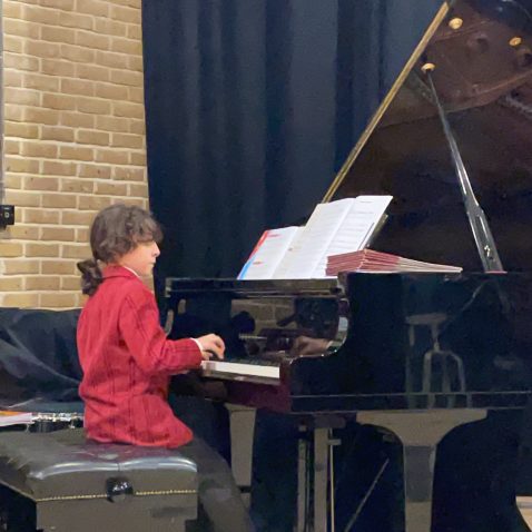 girl playing the piano