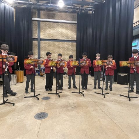 children rehearsing for the ensemble concert