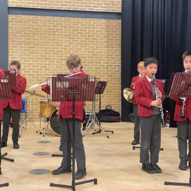 boys playing various instruments