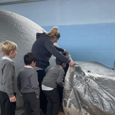 children entering the learning dome