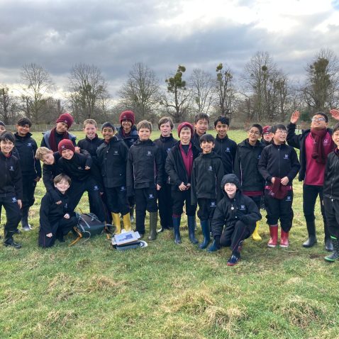 group of students outside on the field