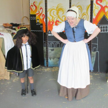 lady and student in costumes