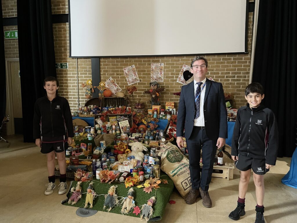students and teacher at a harvest festival