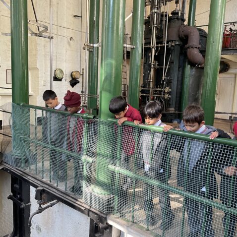 students looking over a balcony