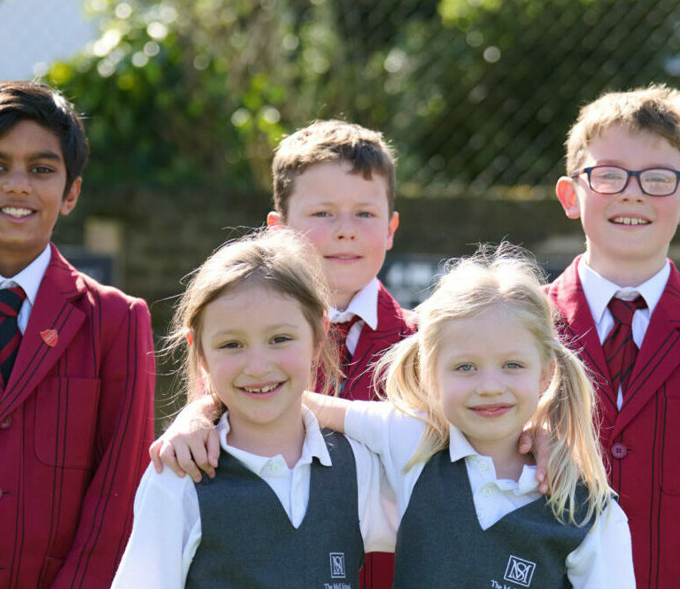 Mixed group of girls and boys in school playground