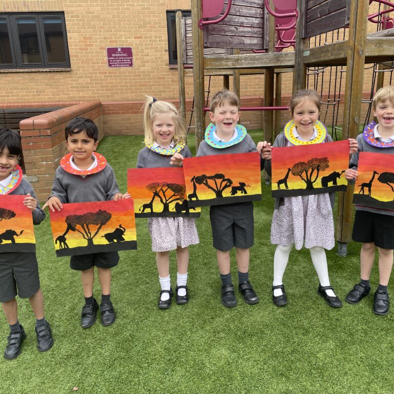 Children displaying their African Savannah pictures