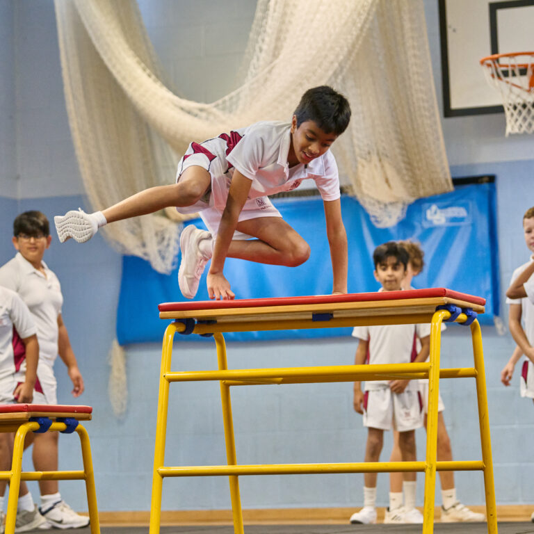 Pupils leaping the vault in PE at The Mall School