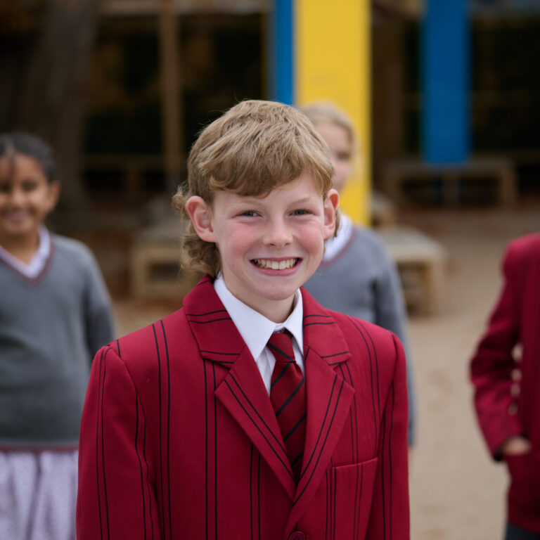 Group of school pupils in the playground at The Mall School