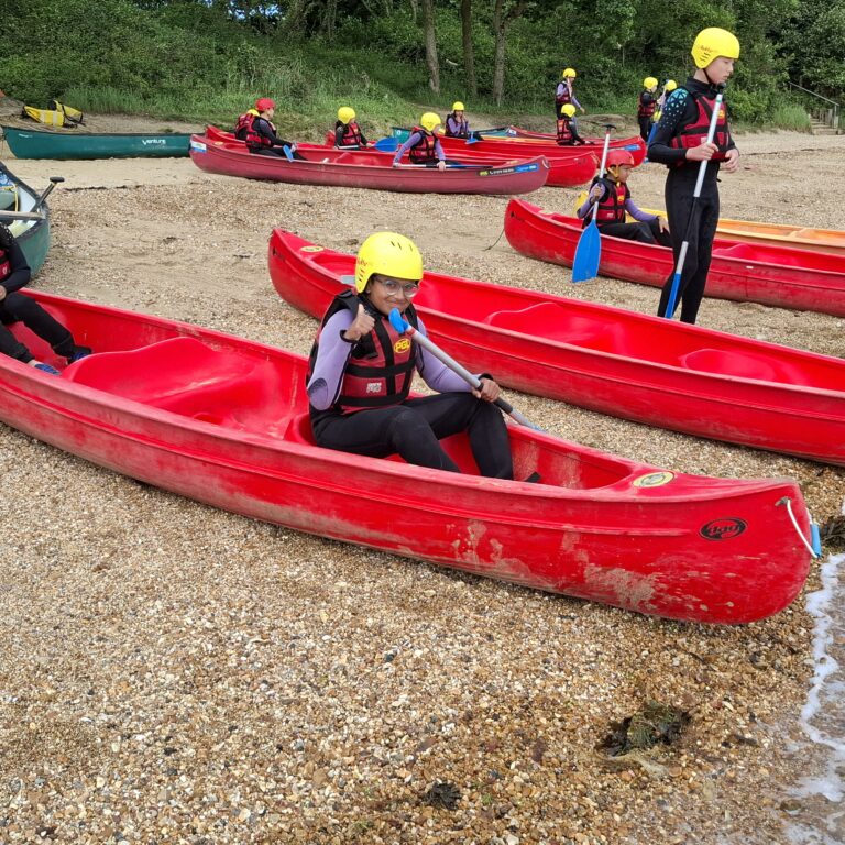Year 6 pupils getting ready for kayaking on their residential trip to the Isle of Wight